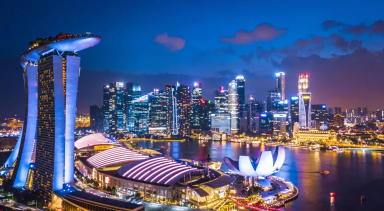 Aerial-view-of-Singapore-skyline-at-night-near-Marina-Bay-Singapore_shutterstock_1116483092.jpg